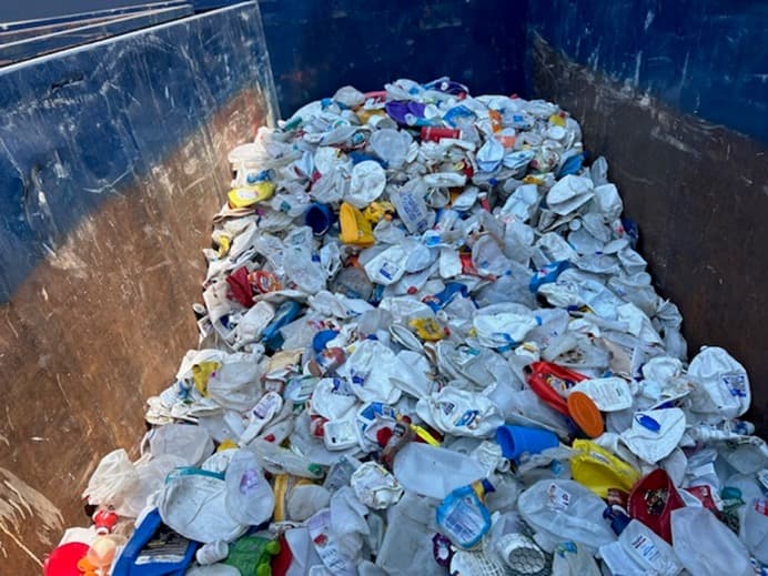 Clear HDPE, sorted prior to baling for market.