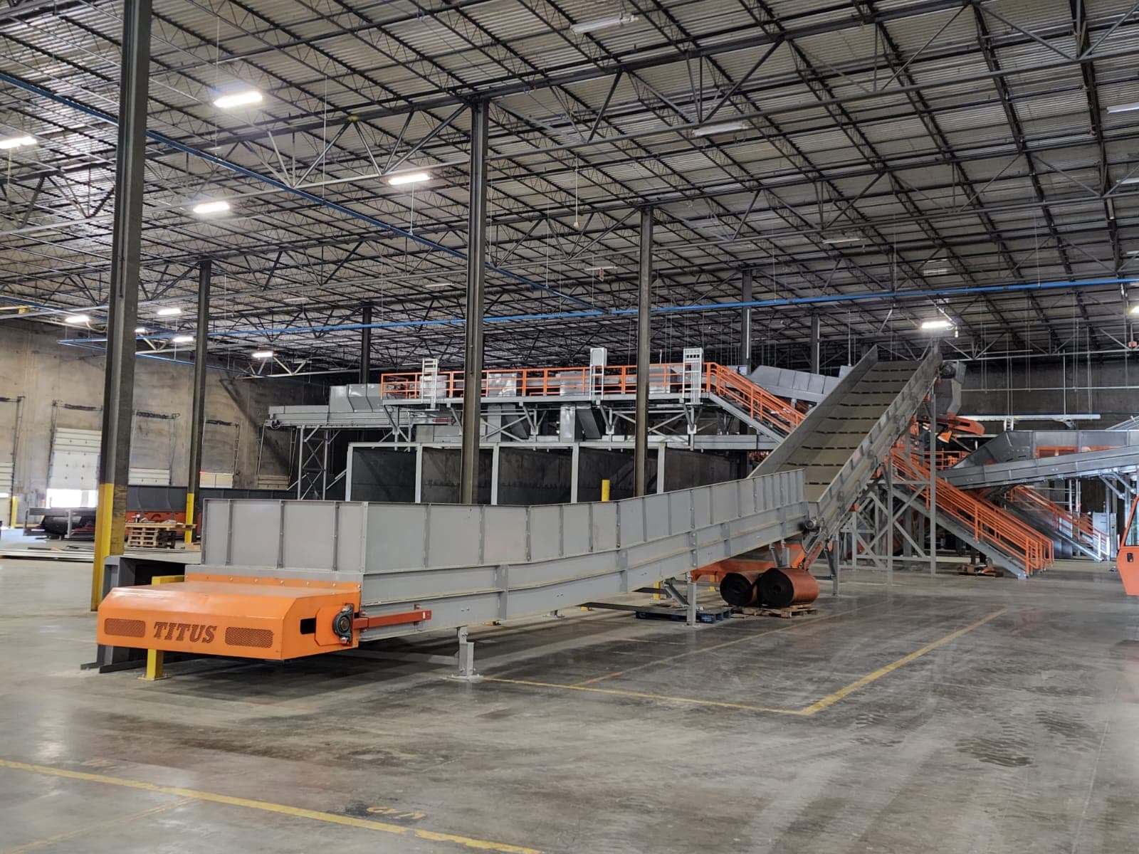 Titus-branded infeed conveyor, fabricated in-house