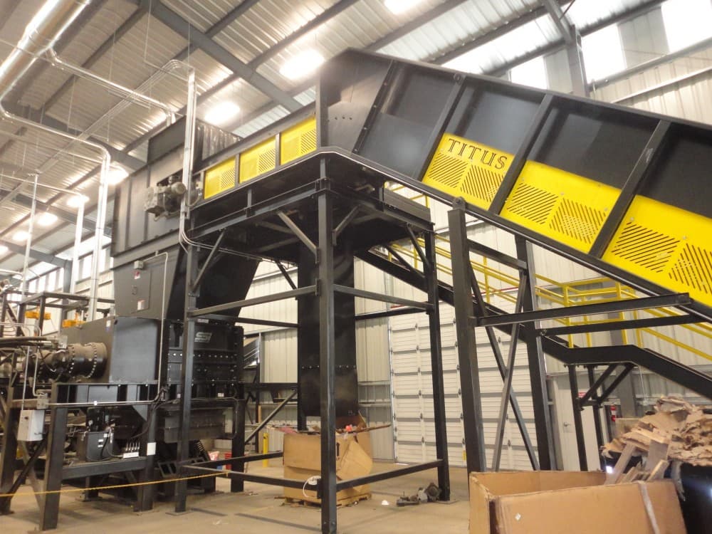 Titus-branded sorting system installed on a plant floor
