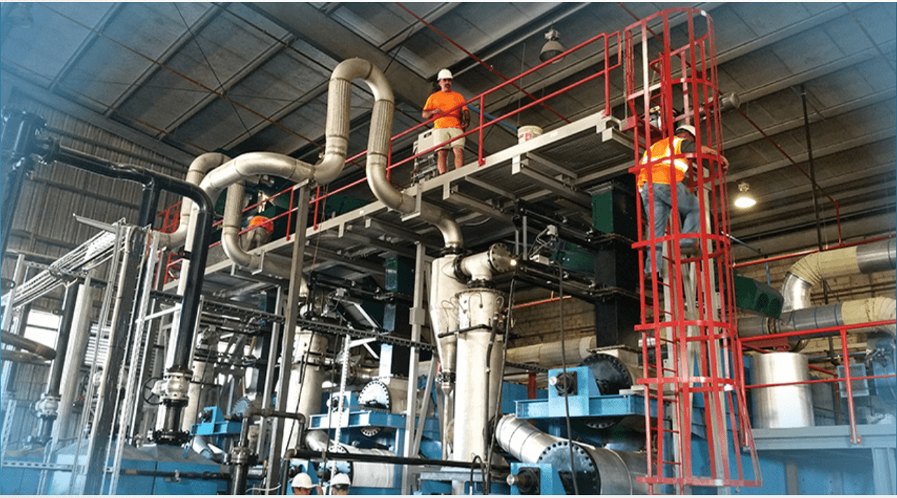 Titus engineers reviewing a commissioned processing system on-site