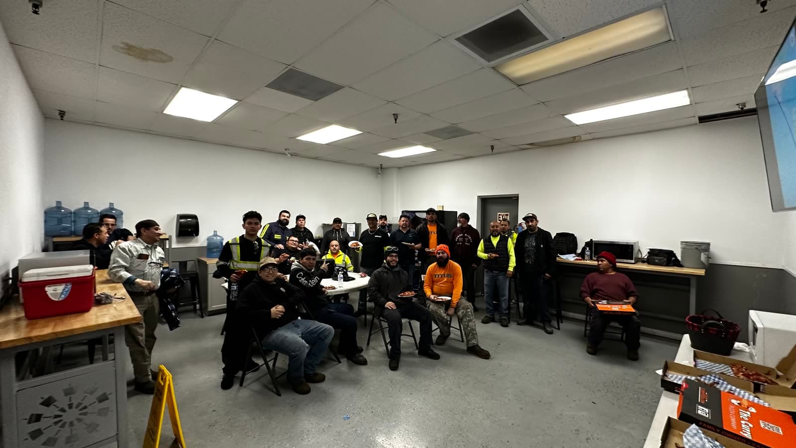 The Titus team sharing a meal in the shop break room